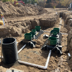 PEX plumbing trench installation for a residential or commercial property, showcasing professional underground pipework and drainage system setup by MCM Plumbing.